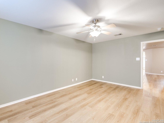 unfurnished room with light wood-type flooring and ceiling fan