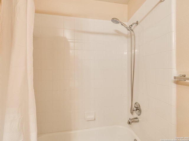 bathroom with shower / tub combo with curtain