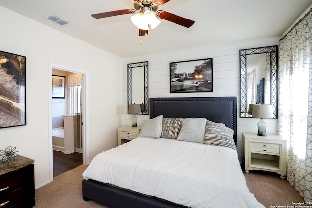 bedroom featuring dark colored carpet and ceiling fan