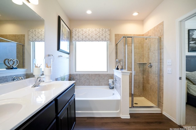 bathroom featuring plenty of natural light, vanity, independent shower and bath, and hardwood / wood-style flooring