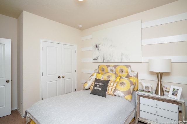 carpeted bedroom featuring a closet