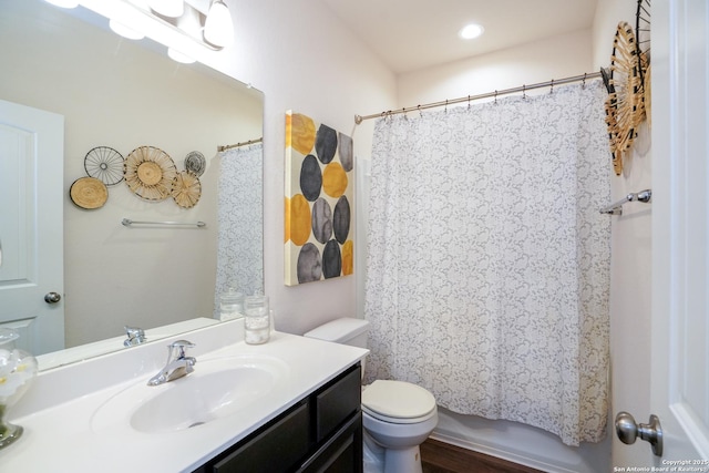 full bathroom featuring vanity, shower / tub combo, and toilet