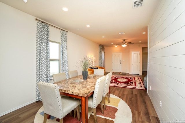 dining room featuring dark hardwood / wood-style flooring and ceiling fan