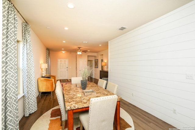 dining room featuring ceiling fan and dark hardwood / wood-style flooring