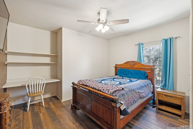 bedroom with dark hardwood / wood-style floors and ceiling fan