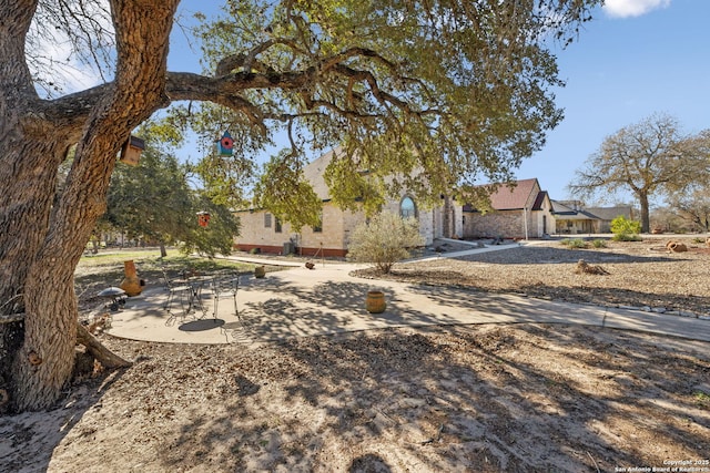 view of front facade with a patio area