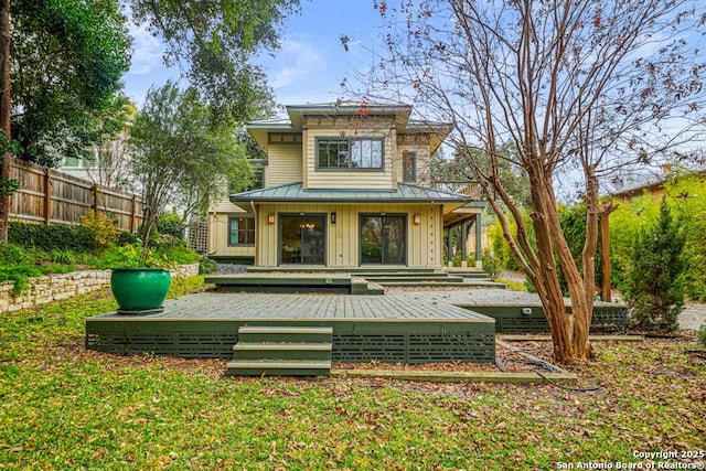 rear view of house with a deck