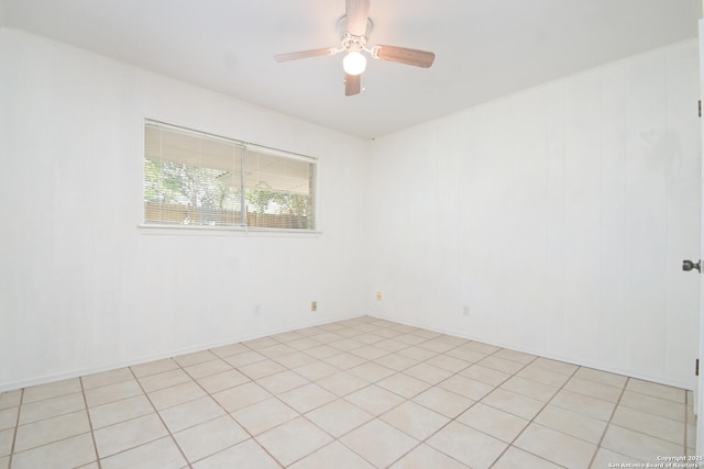 unfurnished room with light tile patterned floors and ceiling fan