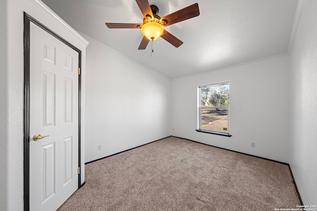 interior space featuring ceiling fan, light colored carpet, and ornamental molding