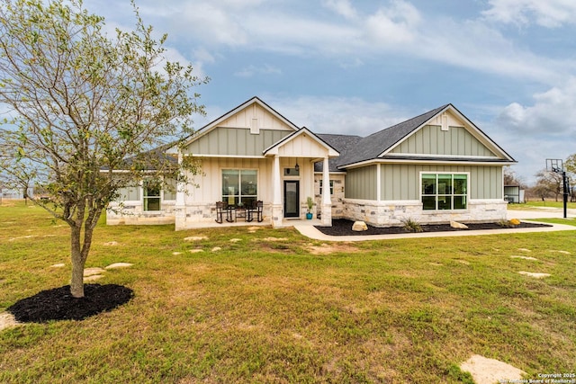 view of front of house featuring a front lawn and a patio area