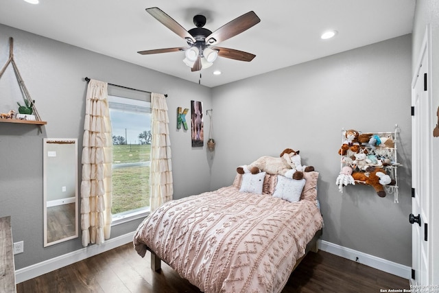 bedroom featuring ceiling fan and dark wood-type flooring