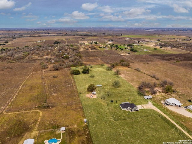 birds eye view of property with a rural view