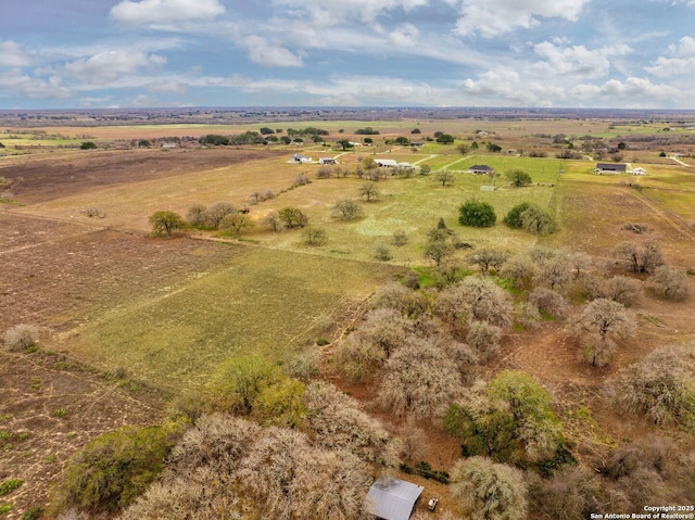 birds eye view of property featuring a rural view