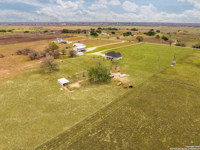 birds eye view of property featuring a rural view