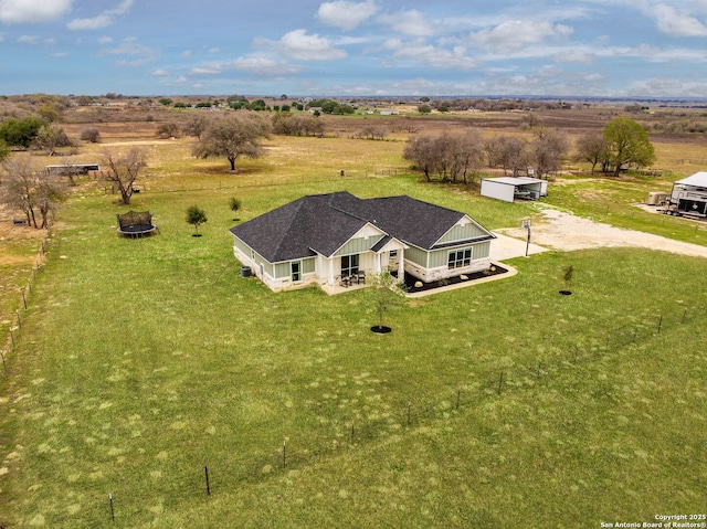 birds eye view of property featuring a rural view