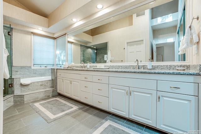 bathroom with vanity, tile patterned floors, and separate shower and tub