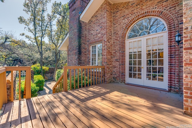 wooden terrace featuring french doors