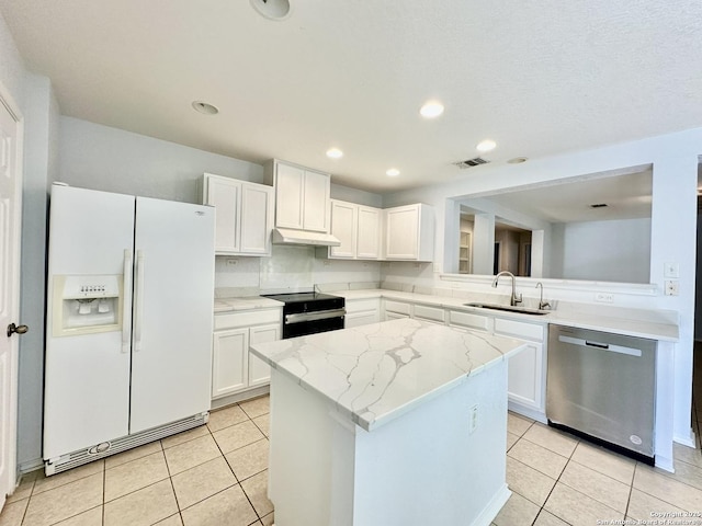 kitchen with white cabinets, black electric range, sink, dishwasher, and white fridge with ice dispenser