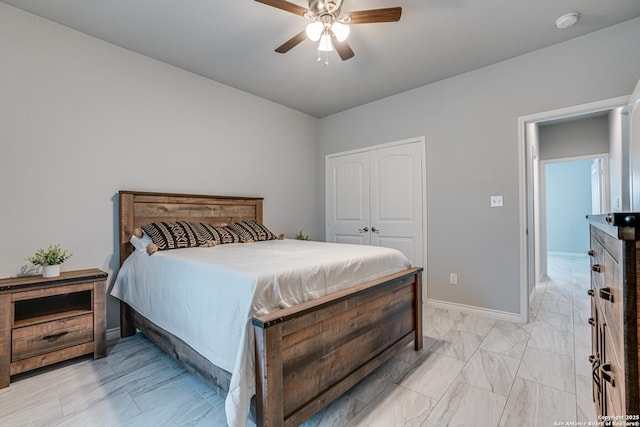 bedroom featuring ceiling fan and a closet