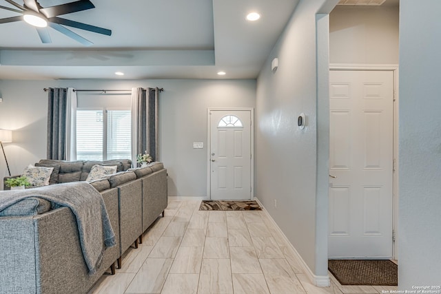 foyer featuring ceiling fan