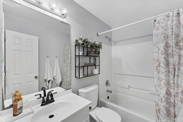 full bathroom with vanity, toilet, and shower / bath combo with shower curtain