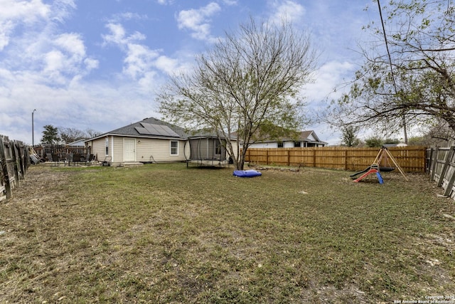 view of yard with a trampoline