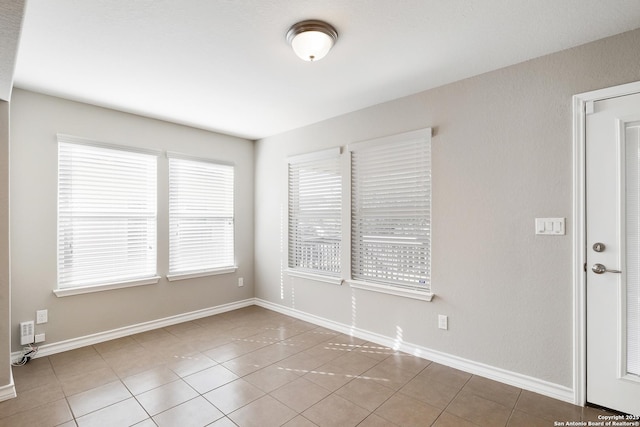 view of tiled spare room