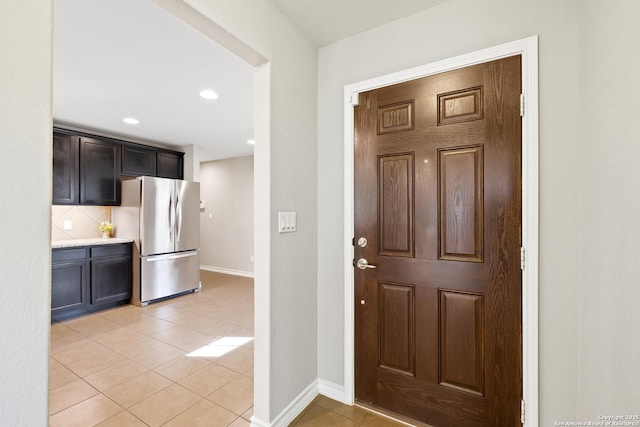 entrance foyer featuring light tile patterned floors