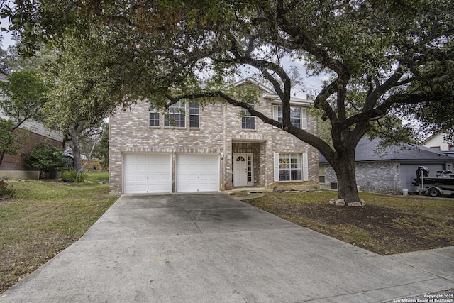 view of front of home featuring a front yard and a garage