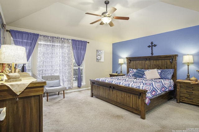 carpeted bedroom featuring ceiling fan and lofted ceiling