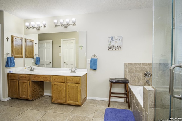 bathroom with plus walk in shower, vanity, and a textured ceiling