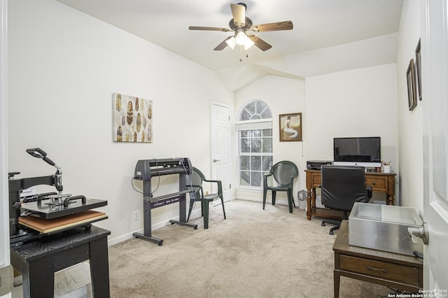 carpeted office space with ceiling fan and lofted ceiling