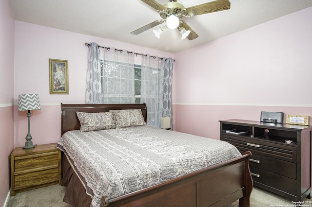 bedroom featuring ceiling fan and light colored carpet