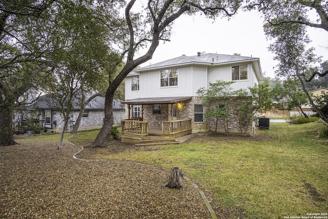 back of house featuring a yard, a deck, and cooling unit