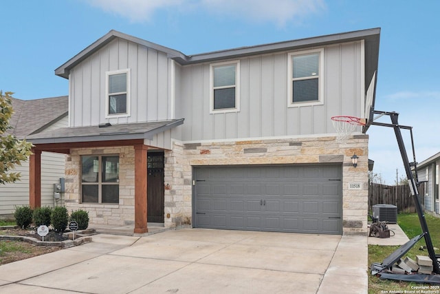 view of front of property featuring cooling unit and a garage