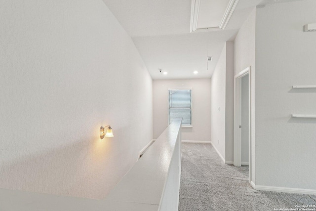 corridor with light colored carpet