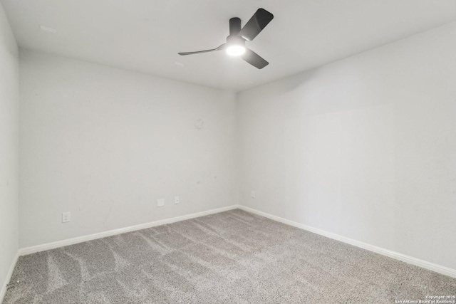 spare room featuring carpet flooring and ceiling fan