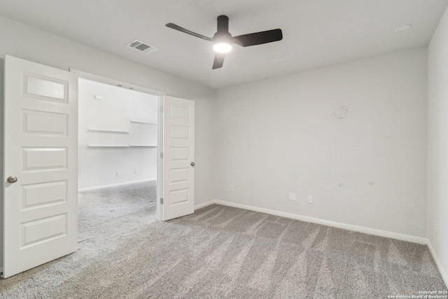 unfurnished bedroom with ceiling fan, a closet, and carpet floors