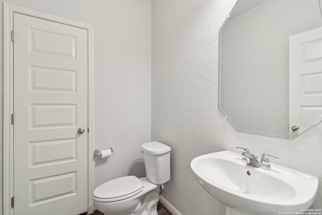 bathroom with toilet and sink