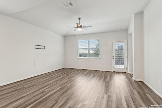 unfurnished room featuring ceiling fan, dark wood-type flooring, and vaulted ceiling