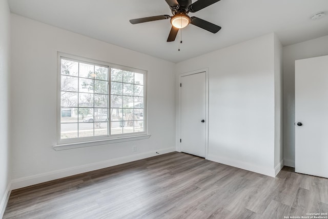 spare room with ceiling fan and light hardwood / wood-style flooring