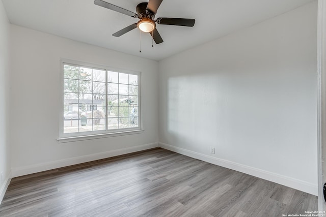 unfurnished room featuring light hardwood / wood-style flooring and ceiling fan