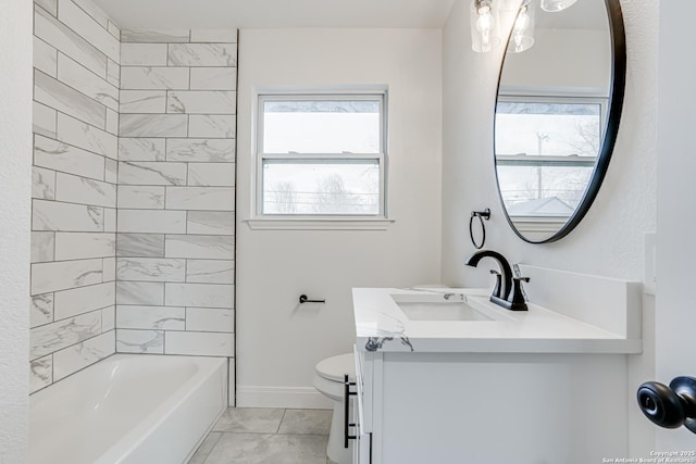 full bathroom with vanity, toilet, and tiled shower / bath