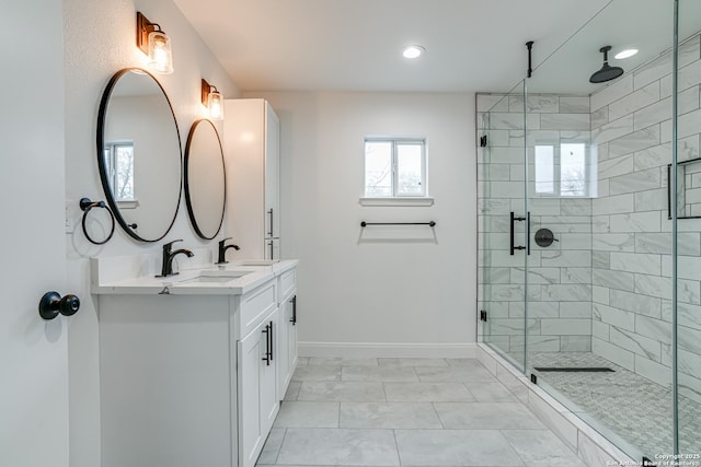 bathroom featuring vanity, tile patterned flooring, and walk in shower