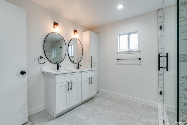 bathroom featuring vanity and a shower with shower door