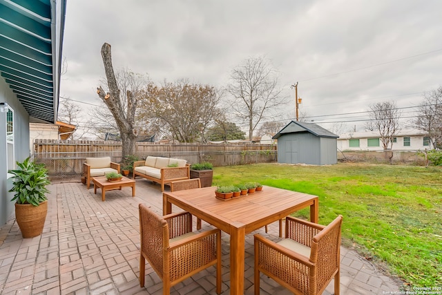 view of patio with a storage shed and outdoor lounge area