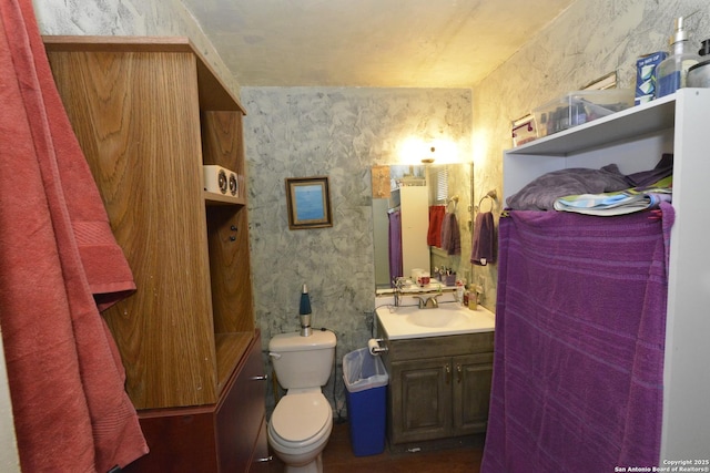 bathroom with vanity and toilet