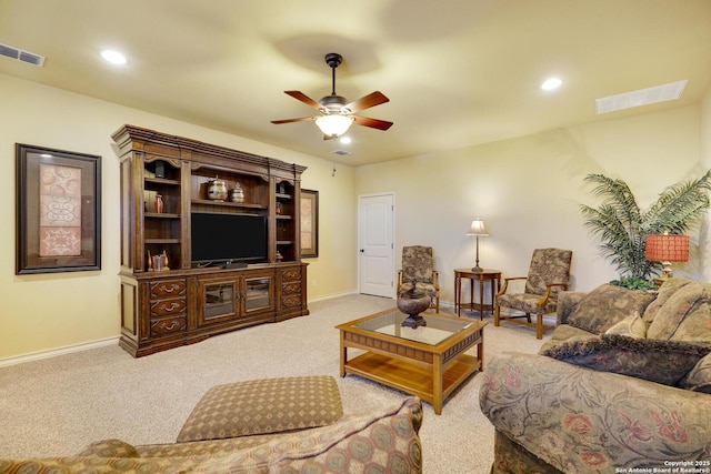 living room featuring light carpet and ceiling fan