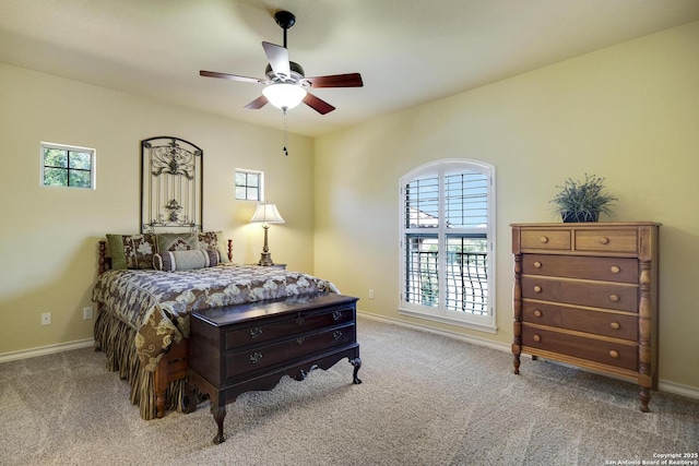 bedroom featuring ceiling fan and light carpet