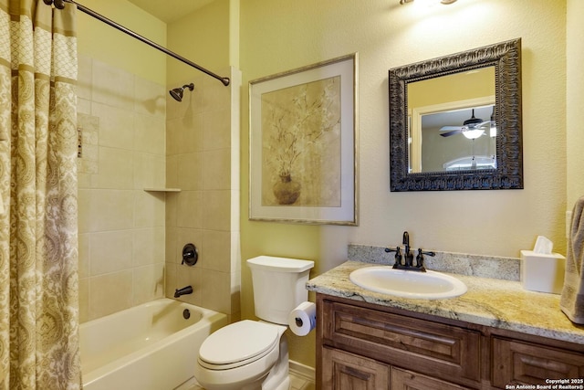 full bathroom featuring vanity, toilet, ceiling fan, and shower / bath combo with shower curtain